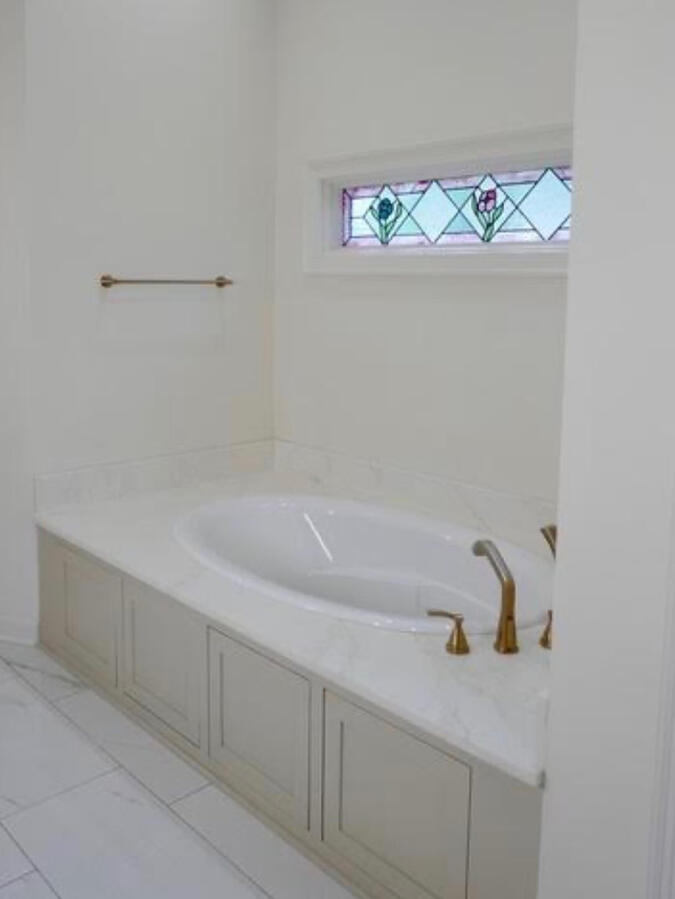 A primary bath designed to feel elevated, timeless, and beautifully functional for both masculine and feminine aesthetics.